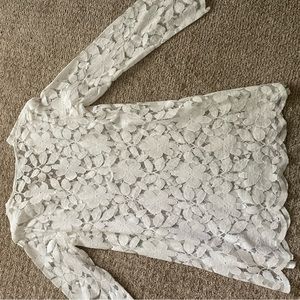 White long sleeved lace swim suit cover up.